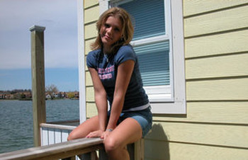 Cute young Karen squats on the pier to flash a hot cotton panty upskirt