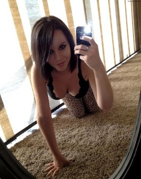 Beautiful amateur model Bryci slips off sexy pantyhose while taking selfies